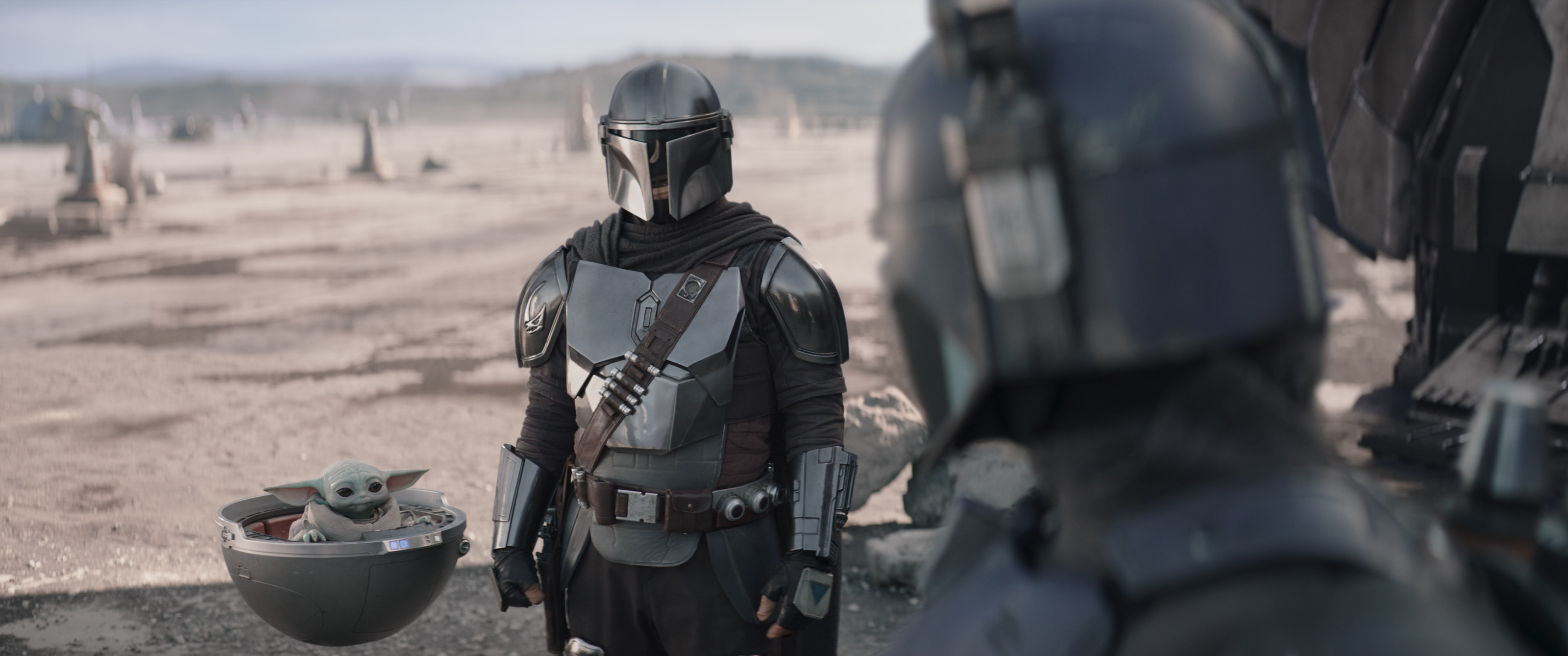(L-R): Grogu, Din Djarin (Pedro Pascal) and Paz Vizsla (Tait Fletcher) in Lucasfilm's THE MANDALORIAN, season three, exclusively on Disney+. ?2023 Lucasfilm Ltd. & TM. All Rights Reserved.