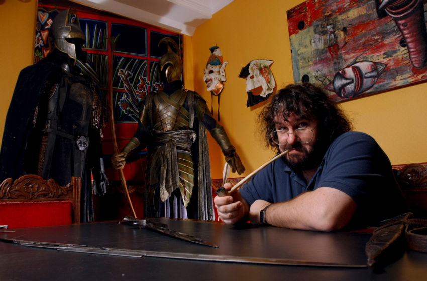 WELLINGTON, NEW ZEALAND - MARCH 15: Peter Jackson, New Zealand director of The Lord of the Rings trilogy poses with the props from the fil set in his Wingnut Films office in Wellington New Zealand. Jackson has been nominated for best director at the 2002 Academy Awards and his film 'The fellowship of the Ring' has a further 12 nominations. (Photo by Robert Patterson/Getty Images)